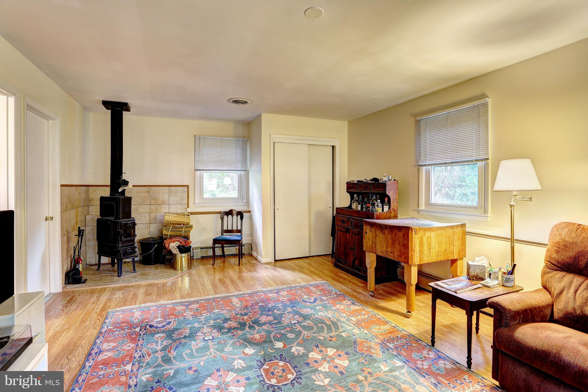 378 Dutch Ship Road Pasadena, MD 21122 - Photo 12 of 27 Family Room with woodstove