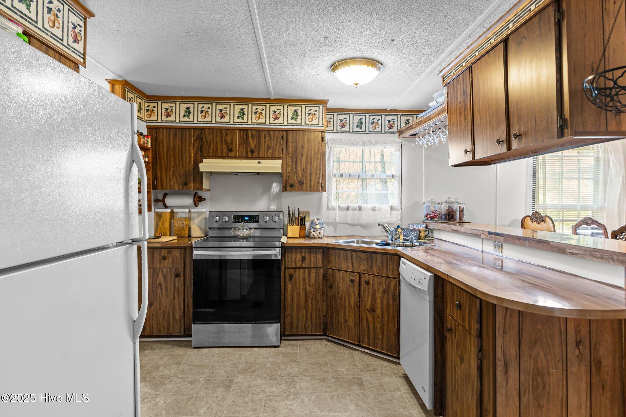 1850 Thorpe Landing Road Southwest Ocean Isle Beach, NC 28469 - Photo 13 of 30 kitchen 2