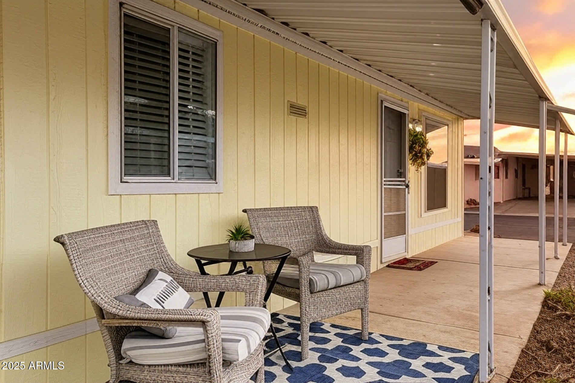 834 South Meridian Road, Unit 164 Apache Junction, AZ 85120 - Photo 14 of 16 a patio with table and chairs