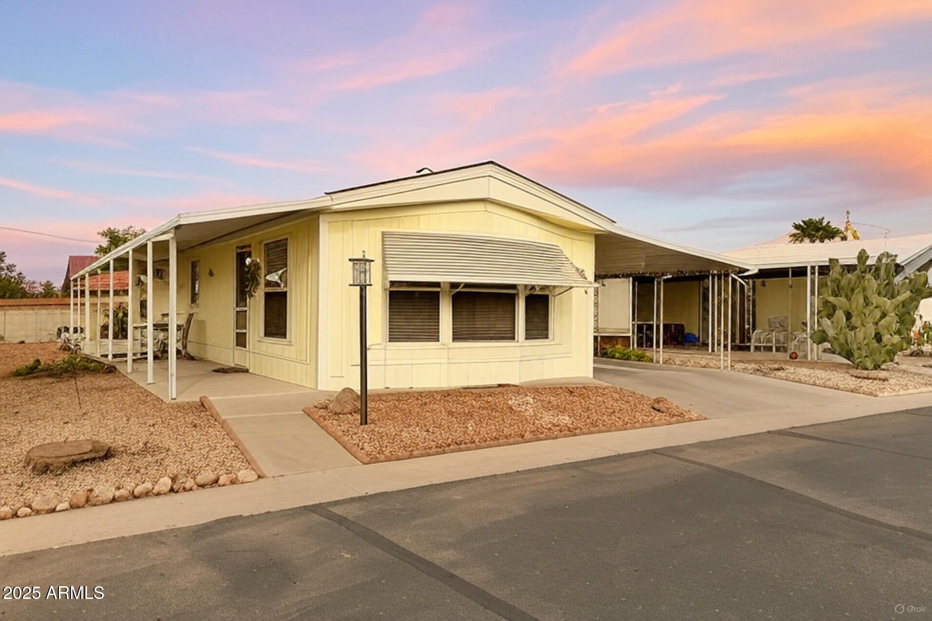 834 South Meridian Road, Unit 164 Apache Junction, AZ 85120 - Photo 15 of 16 a front view of a house with a garage