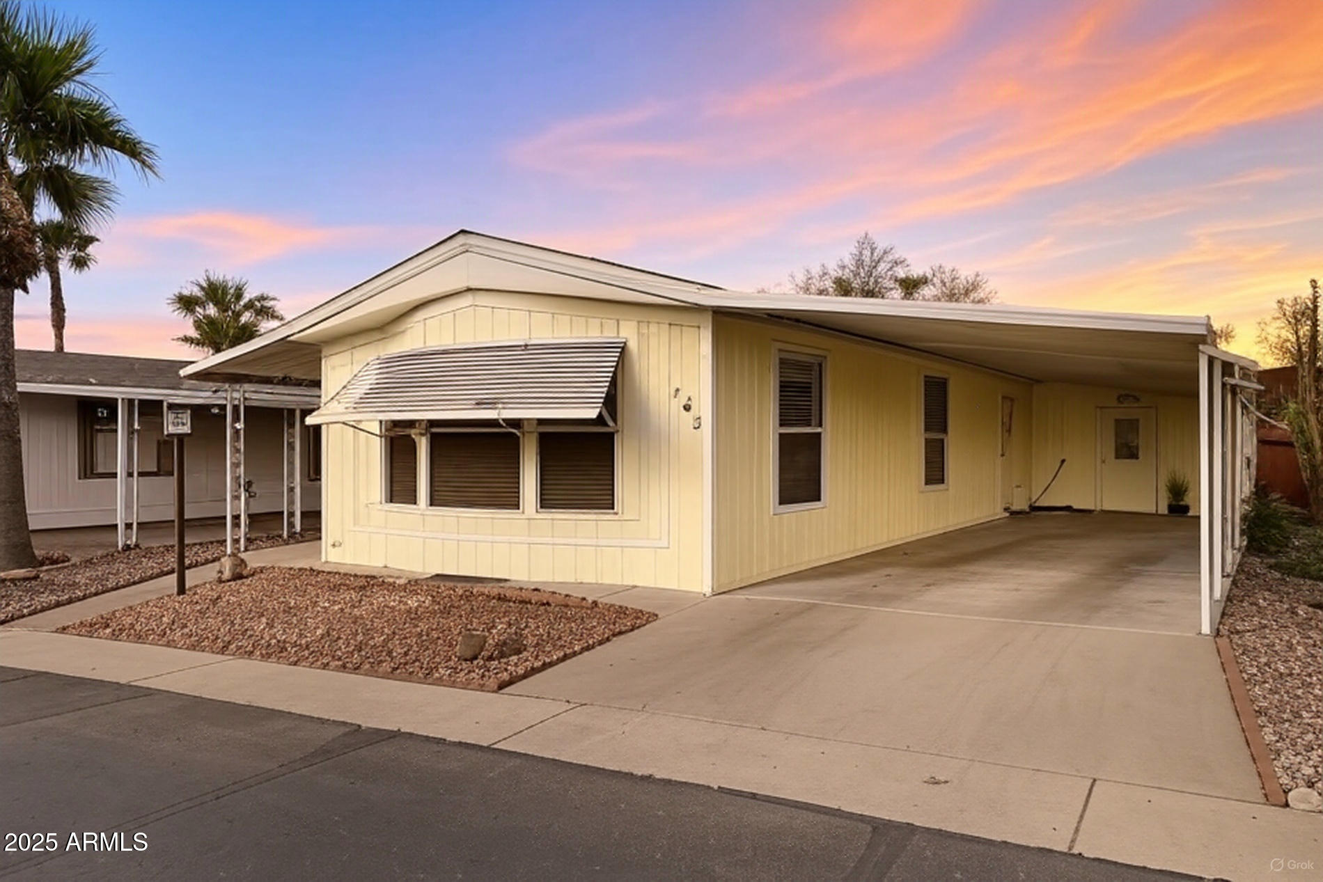 834 South Meridian Road, Unit 164 Apache Junction, AZ 85120 - Photo 16 of 16 a front view of a house with yard