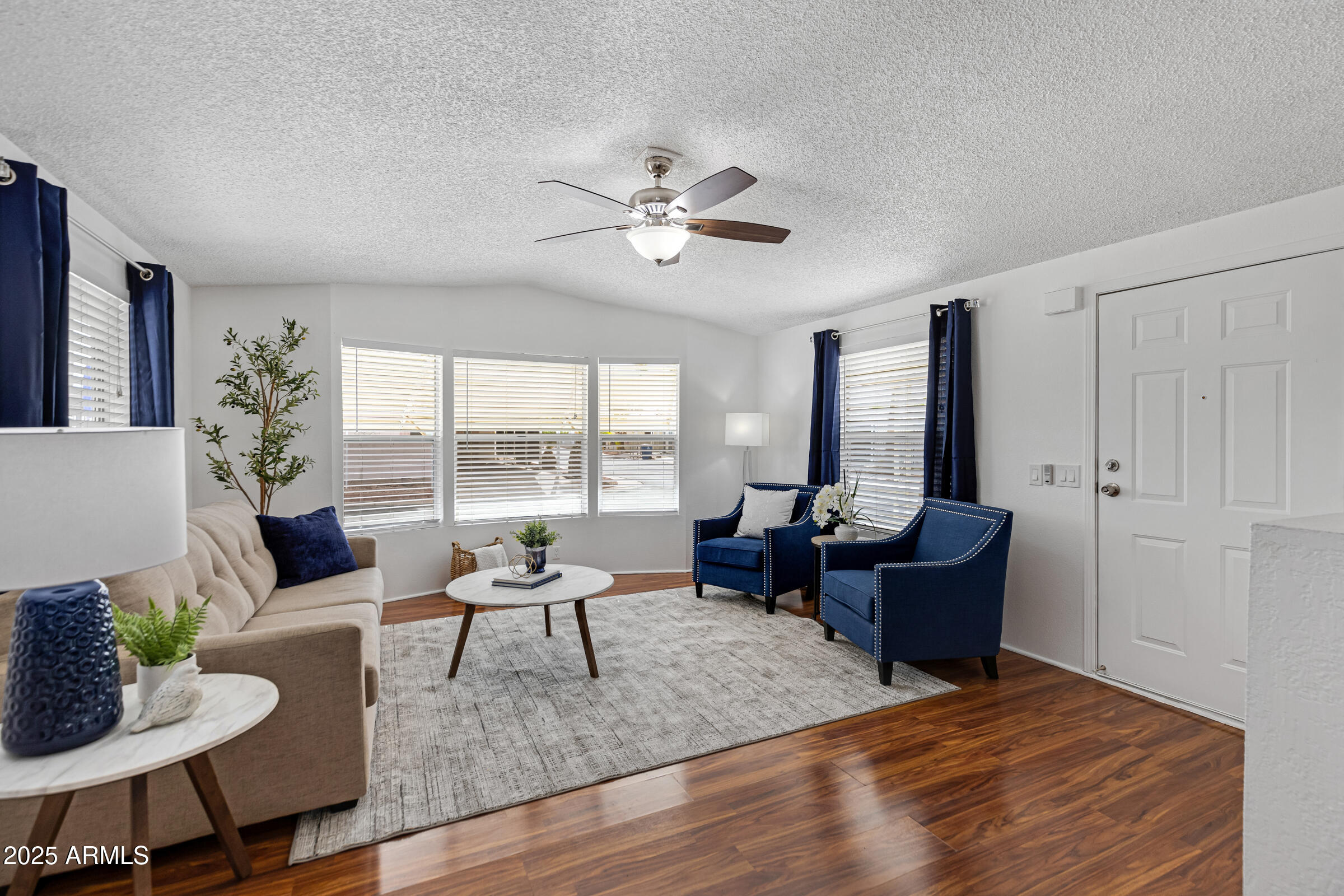 834 South Meridian Road, Unit 164 Apache Junction, AZ 85120 - Photo 2 of 16 a living room with furniture and a large window