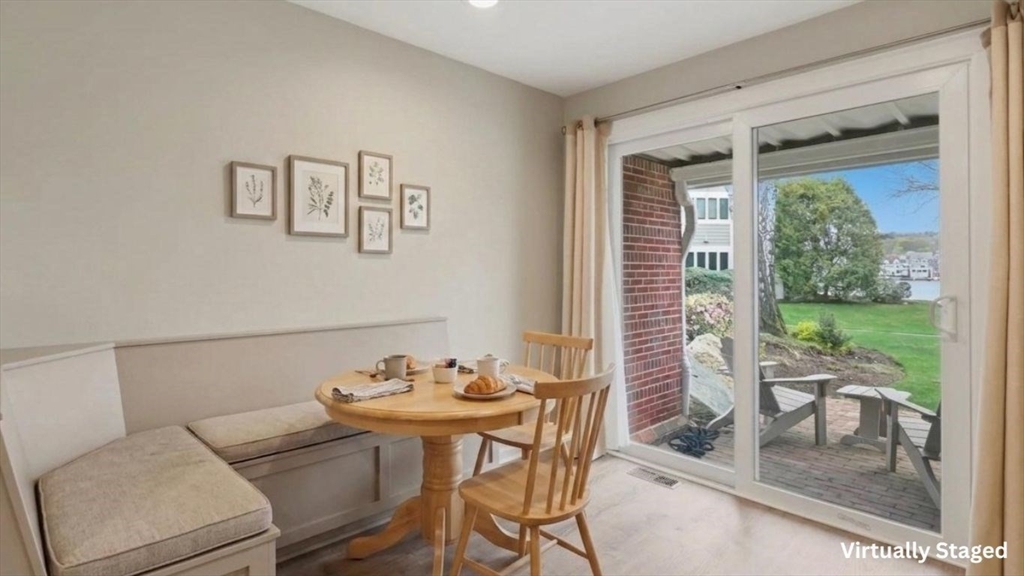 68 South Quinsigamond Avenue, Unit 4 Shrewsbury, MA 01545 - Photo 13 of 37 a view of a dining room with furniture window and outside view