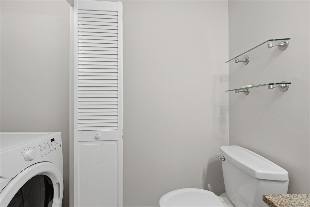 68 South Quinsigamond Avenue, Unit 4 Shrewsbury, MA 01545 - Photo 16 of 37 a white toilet sitting next to a bathroom sink