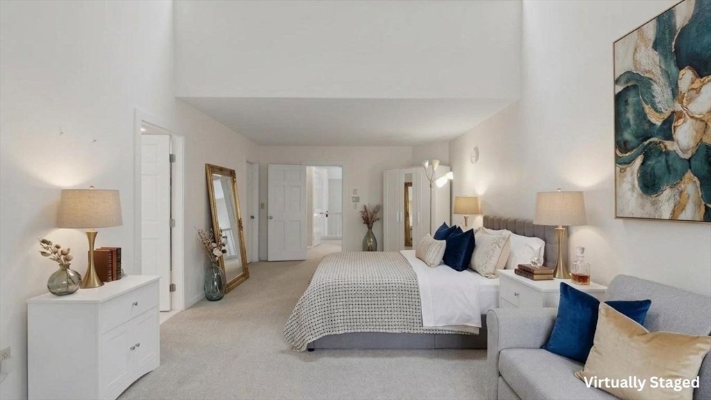 68 South Quinsigamond Avenue, Unit 4 Shrewsbury, MA 01545 - Photo 17 of 37 a bedroom with a bed and a chair