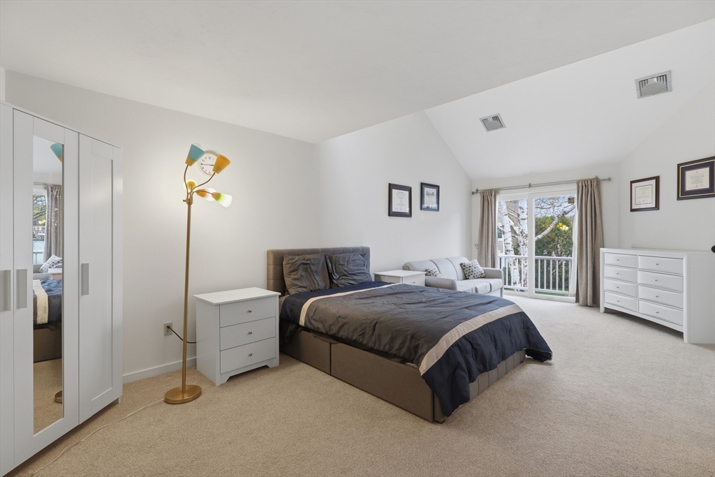 68 South Quinsigamond Avenue, Unit 4 Shrewsbury, MA 01545 - Photo 19 of 37 a spacious bedroom with a bed and a cabinets