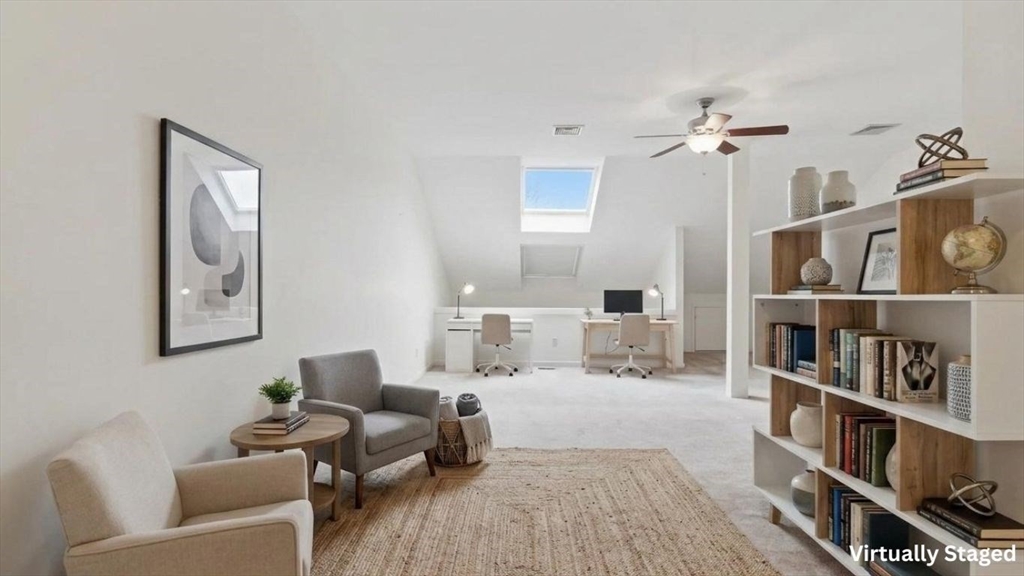 68 South Quinsigamond Avenue, Unit 4 Shrewsbury, MA 01545 - Photo 26 of 37 a living room with furniture and a book shelf