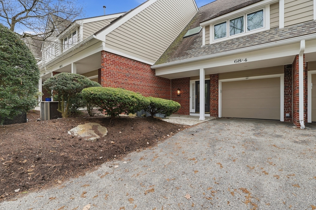 68 South Quinsigamond Avenue, Unit 4 Shrewsbury, MA 01545 - Photo 4 of 37 a view of a house with a yard and garage