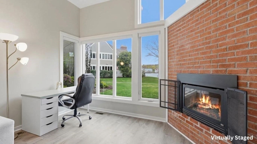 68 South Quinsigamond Avenue, Unit 4 Shrewsbury, MA 01545 - Photo 7 of 37 a living room with furniture a floor to ceiling window and a flat screen tv