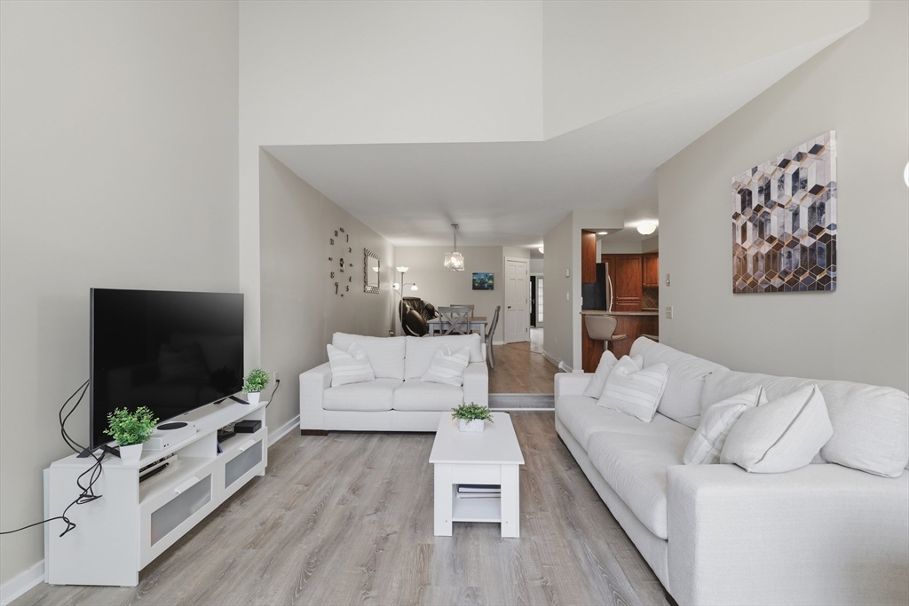 68 South Quinsigamond Avenue, Unit 4 Shrewsbury, MA 01545 - Photo 8 of 37 a living room with furniture and a flat screen tv