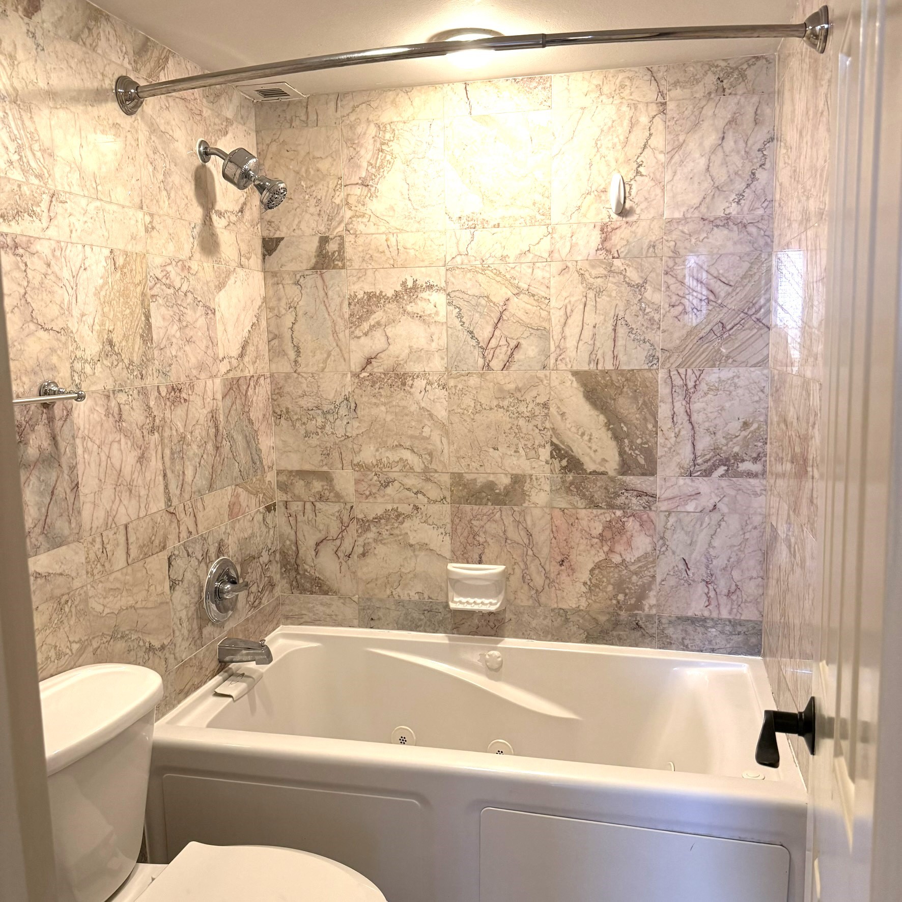 3525 Sage Road, Unit 716 Houston, TX 77056 - Photo 19 of 26 a bathroom with a bathtub and shower