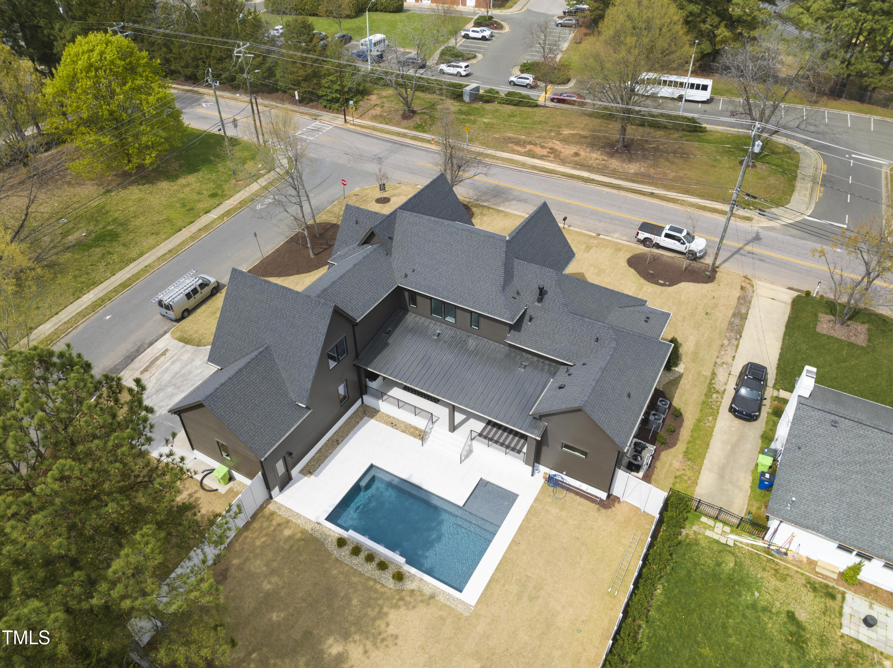 100 East Rowan Street Raleigh, NC 27609 - Photo 3 of 58 an aerial view of residential houses with outdoor space and swimming pool