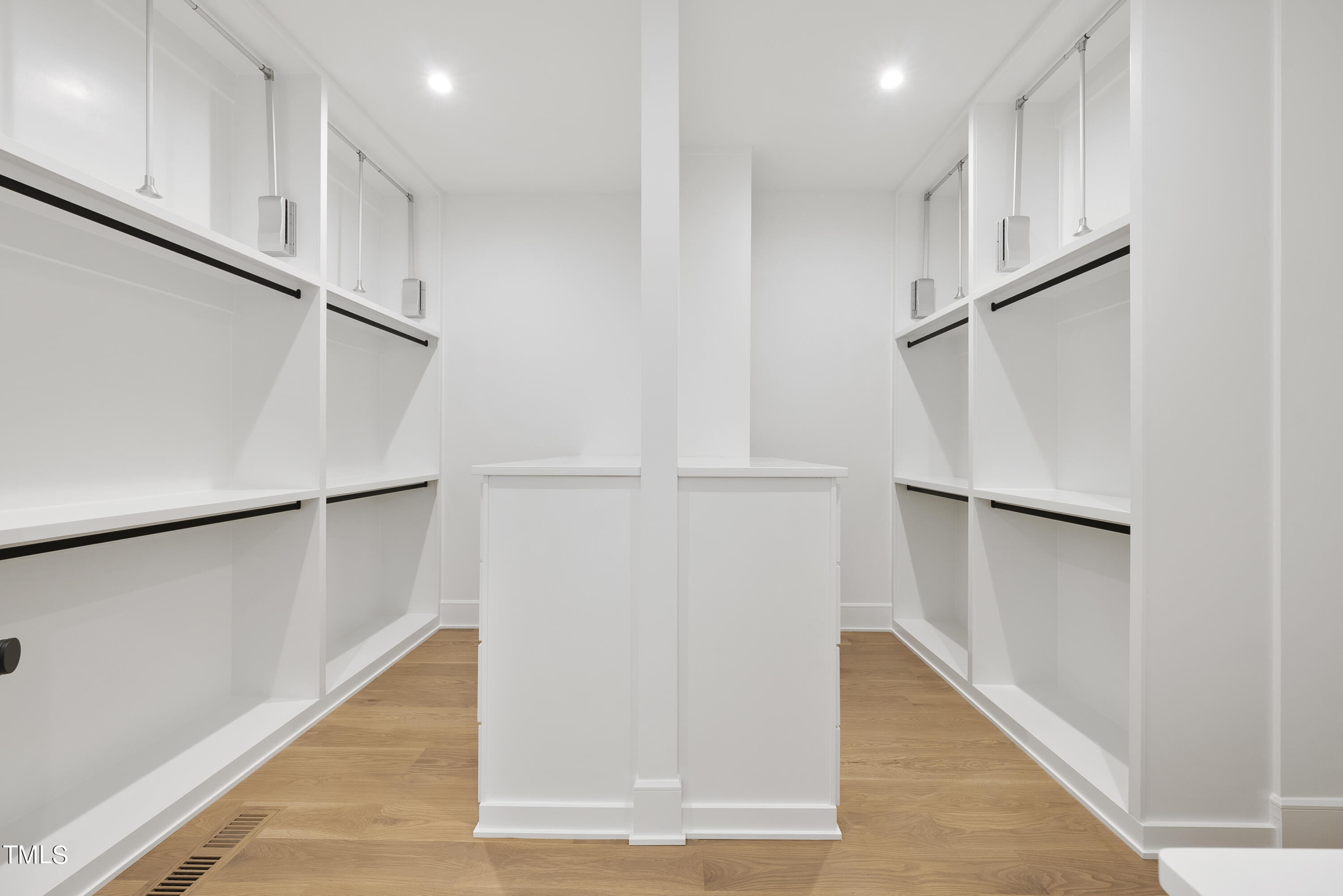100 East Rowan Street Raleigh, NC 27609 - Photo 34 of 58 a view of walk in closet with empty racks