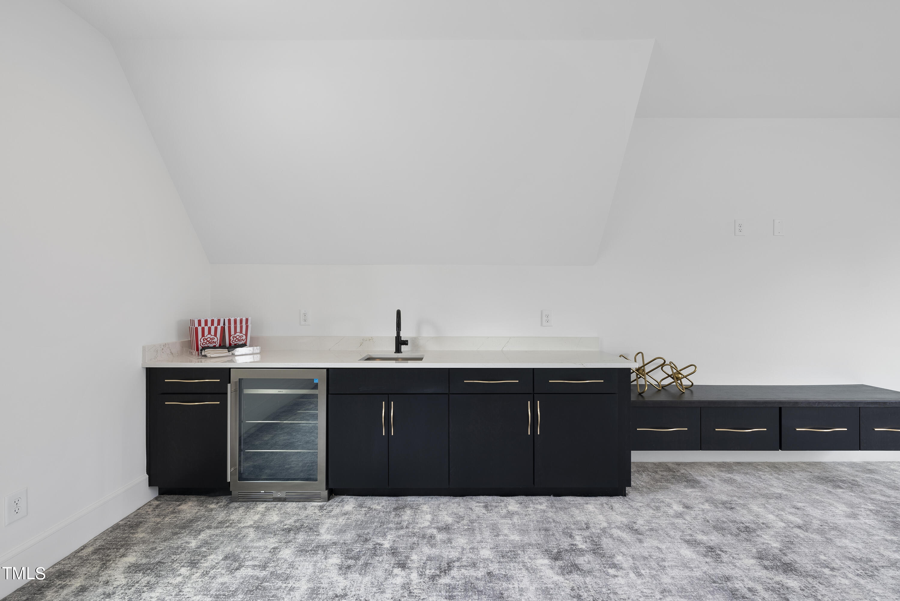 100 East Rowan Street Raleigh, NC 27609 - Photo 45 of 58 a kitchen with a sink and cabinets