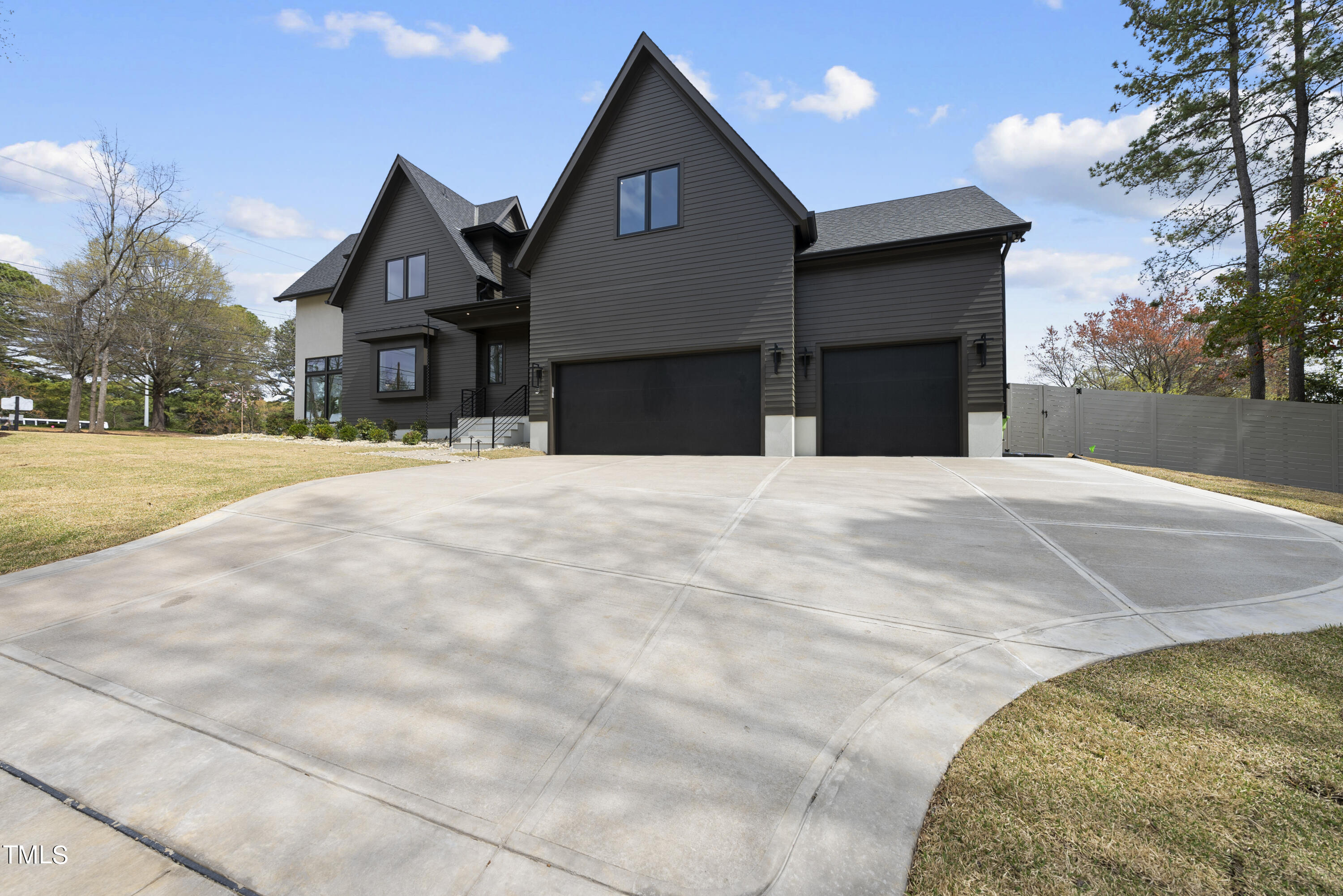 100 East Rowan Street Raleigh, NC 27609 - Photo 58 of 58 a front view of a house with a yard and garage