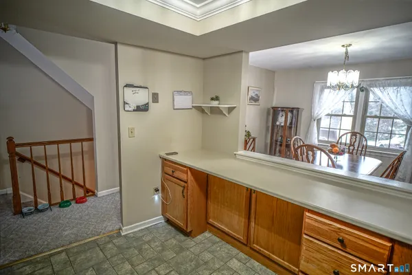a hallway with a sink and a mirror