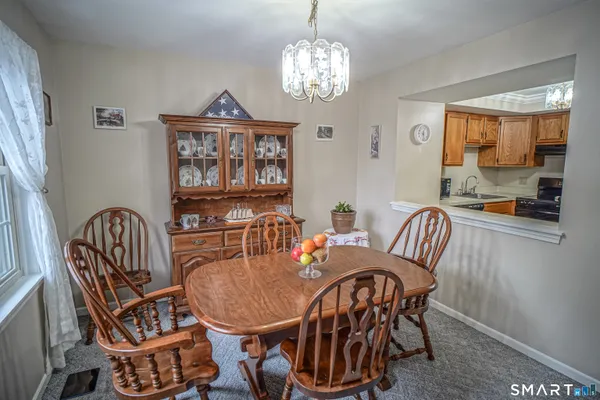 a view of a dining room with furniture window and outside view