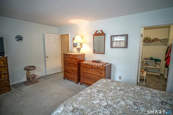 a bedroom with a bed and furniture