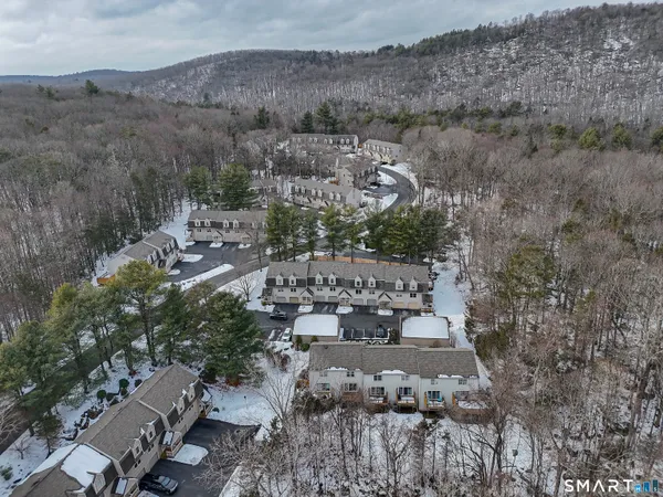 an aerial view of a house with outdoor space