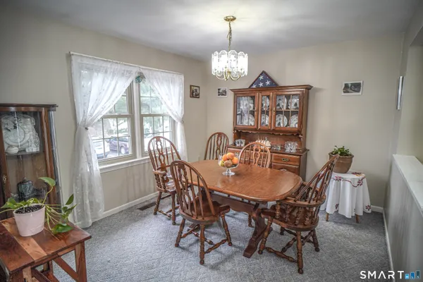 a view of a dining room with furniture window and outside view