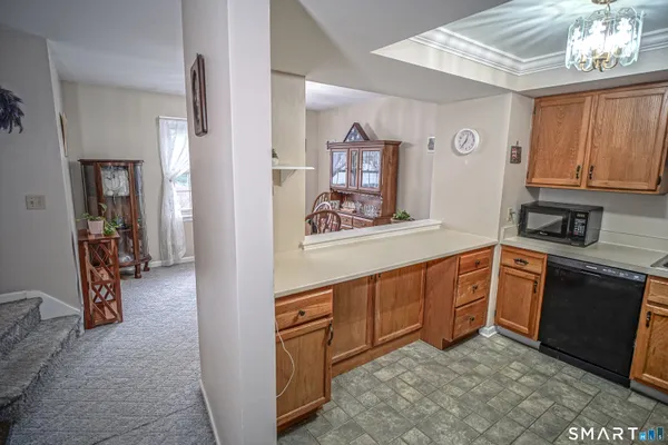 a kitchen with stainless steel appliances granite countertop a sink and cabinets
