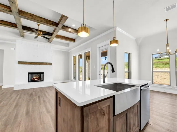 a view of living room with granite countertop furniture and fireplace