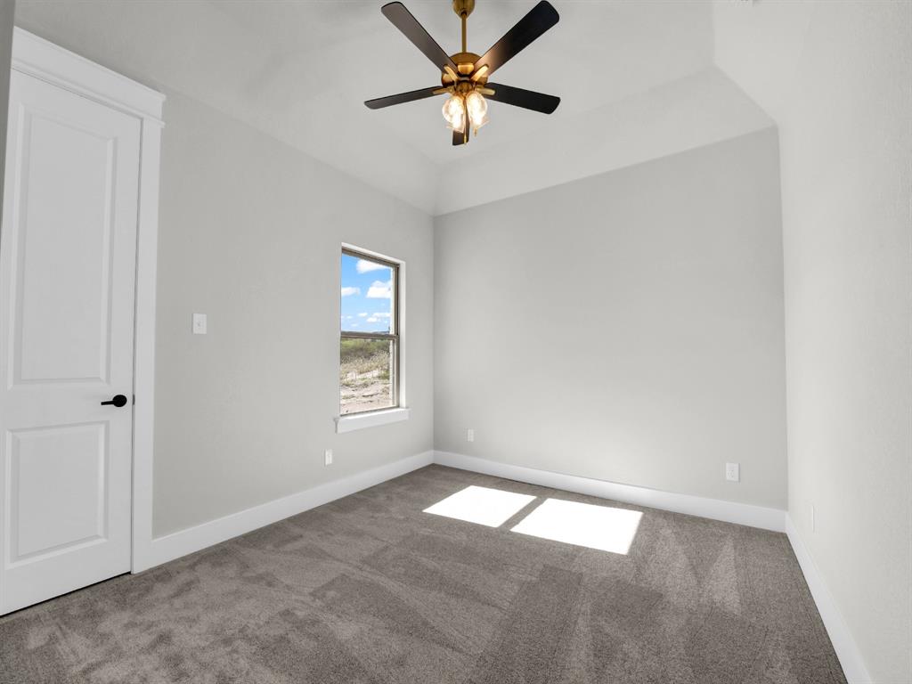3025 West Frk Way Springtown, TX 76082 - Photo 20 of 26 an empty room with a window and a fan