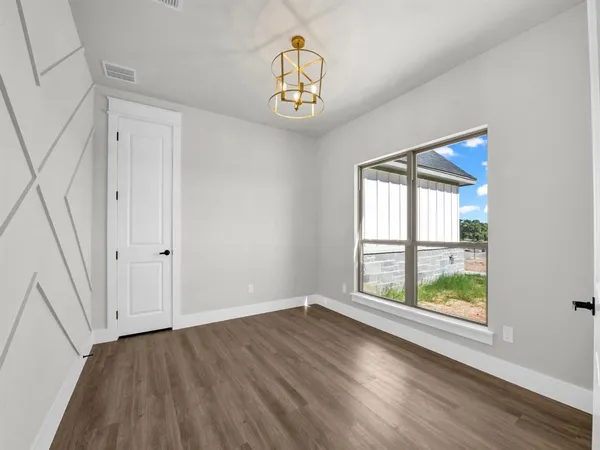 a view of an entryway with wooden floor and window