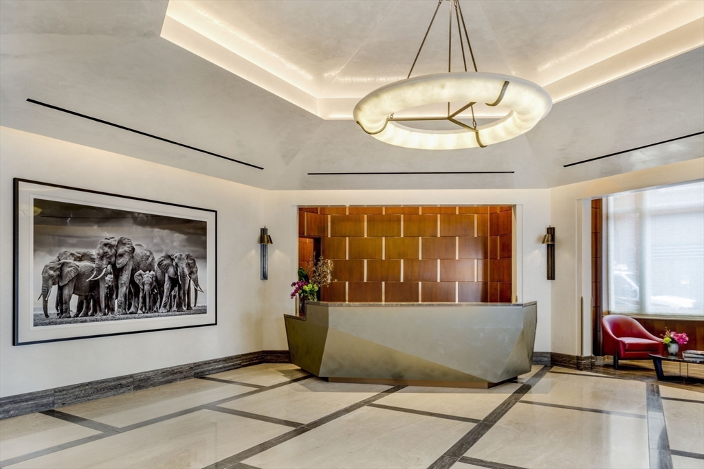 100 Lovejoy Wharf, Unit 14D Boston, MA 02114 - Photo 22 of 34 a view of a living room and a window