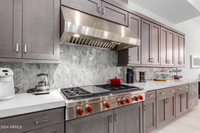 a kitchen with sink cabinets and refrigerator