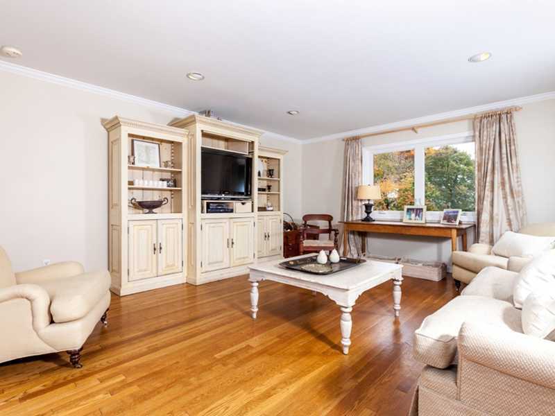 37 Contentment Island Road Darien, CT 06820 - Photo 11 of 24 a living room with furniture and a flat screen tv