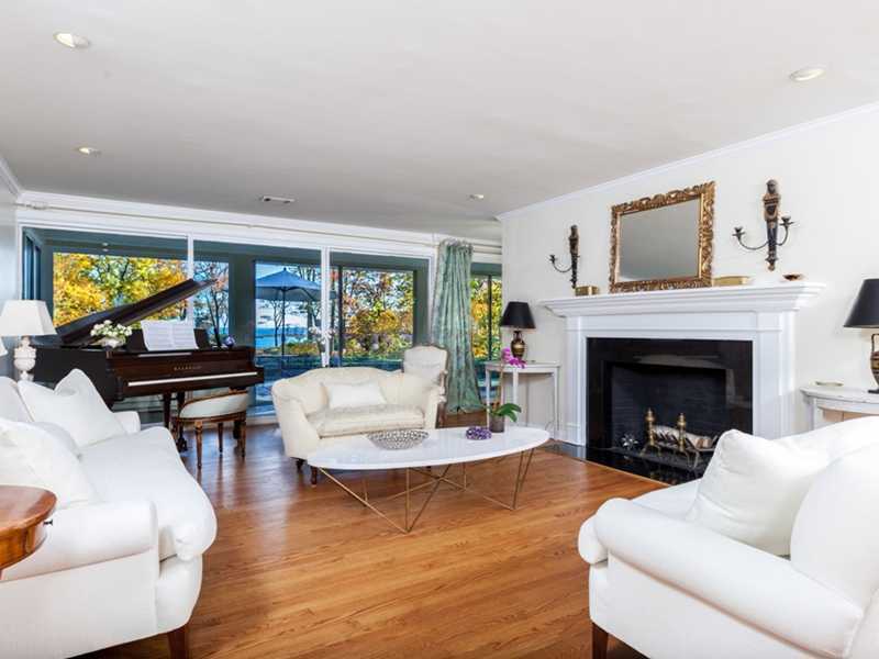 37 Contentment Island Road Darien, CT 06820 - Photo 5 of 24 a living room with fireplace furniture and a fireplace