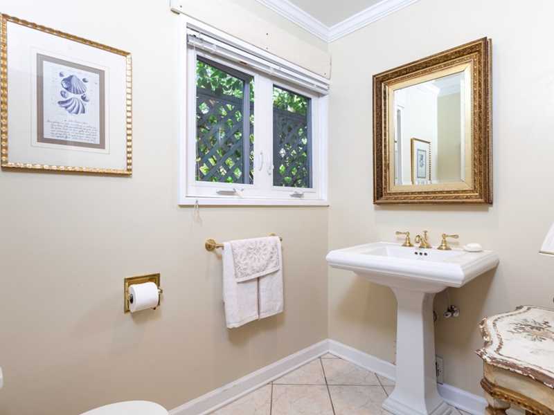 37 Contentment Island Road Darien, CT 06820 - Photo 8 of 24 a bathroom with a sink and a mirror