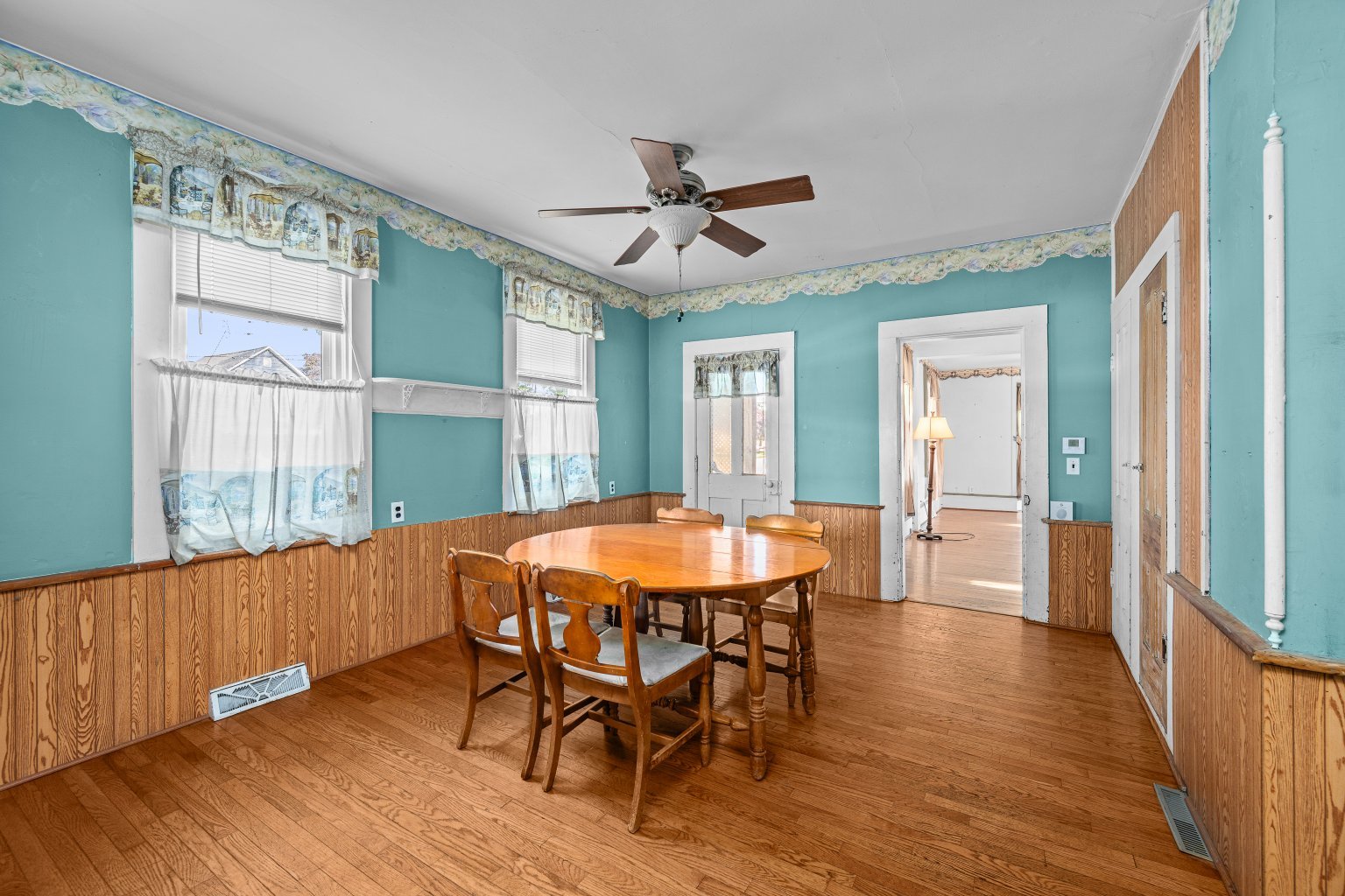 200 West Locust Street Cambridge, IL 61238 - Photo 15 of 32 a dining room with wooden floor and a chandelier