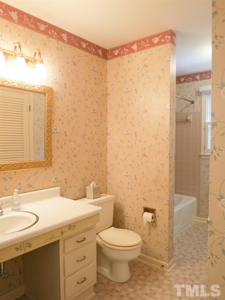 4701 Latimer Road Raleigh, NC 27609 - Photo 14 of 25 View of the lg Hall Bath w/tiled flr, sink, toilet & tiled tub-shower.