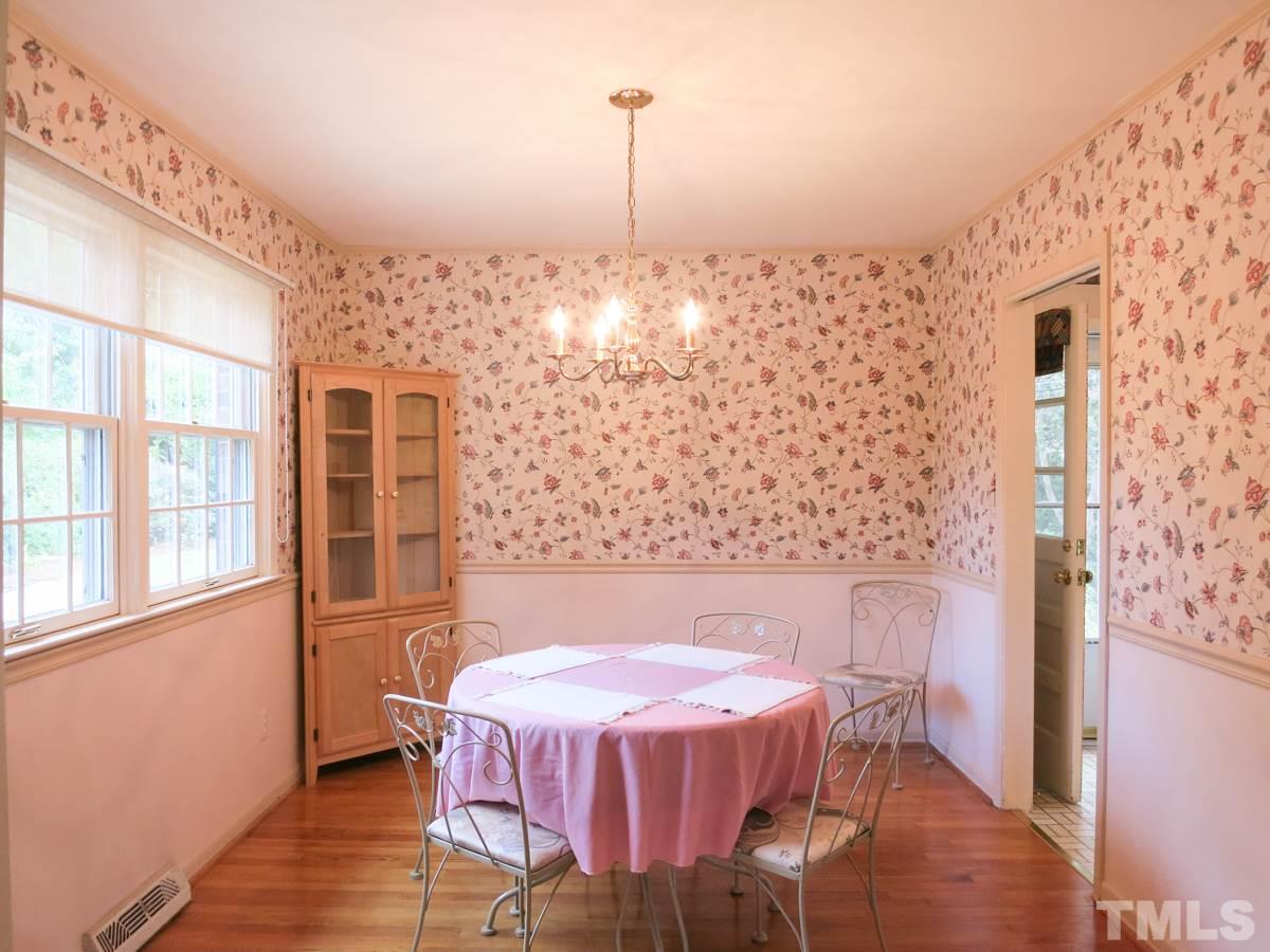 4701 Latimer Road Raleigh, NC 27609 - Photo 5 of 25 The Dining Rm has hardwood flr, crown & chair rail molding.