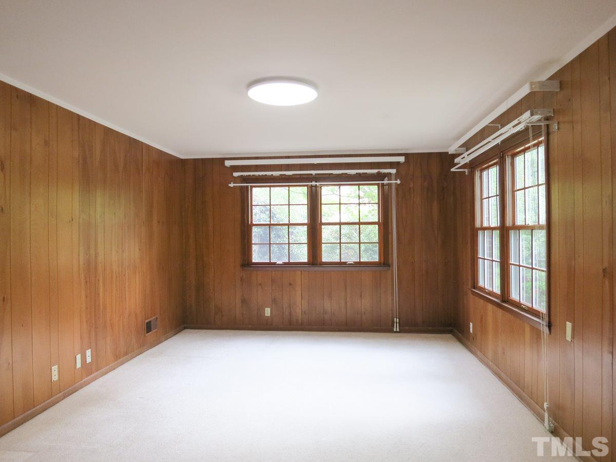 4701 Latimer Road Raleigh, NC 27609 - Photo 9 of 25 The spacious Family Rm is off the Foyer and features neutral carpet & lots of windows.