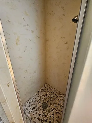 a kitchen with a refrigerator and a sink