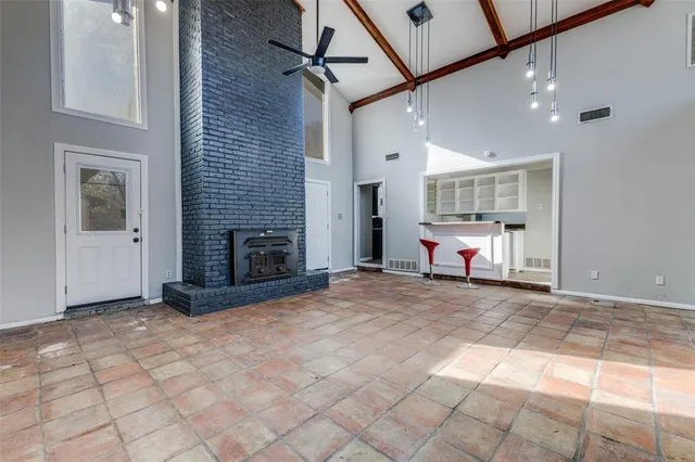 a kitchen with a stove and a chandelier