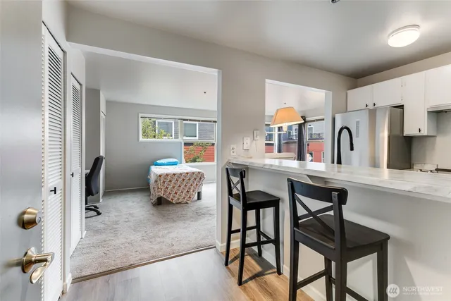 a dining room with furniture and window