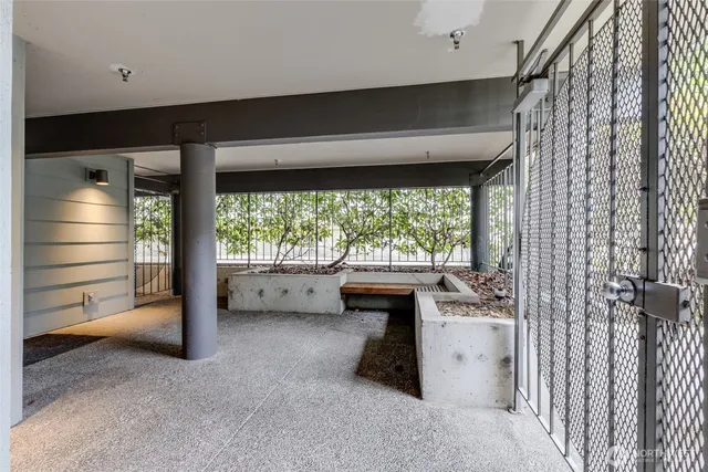 a view of room with window and furniture