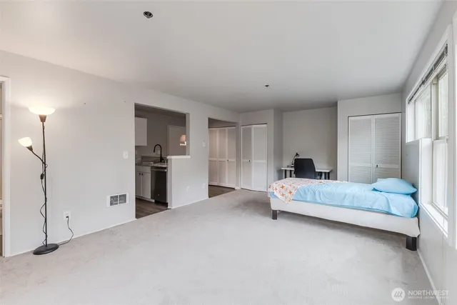 a large white bed in a white room