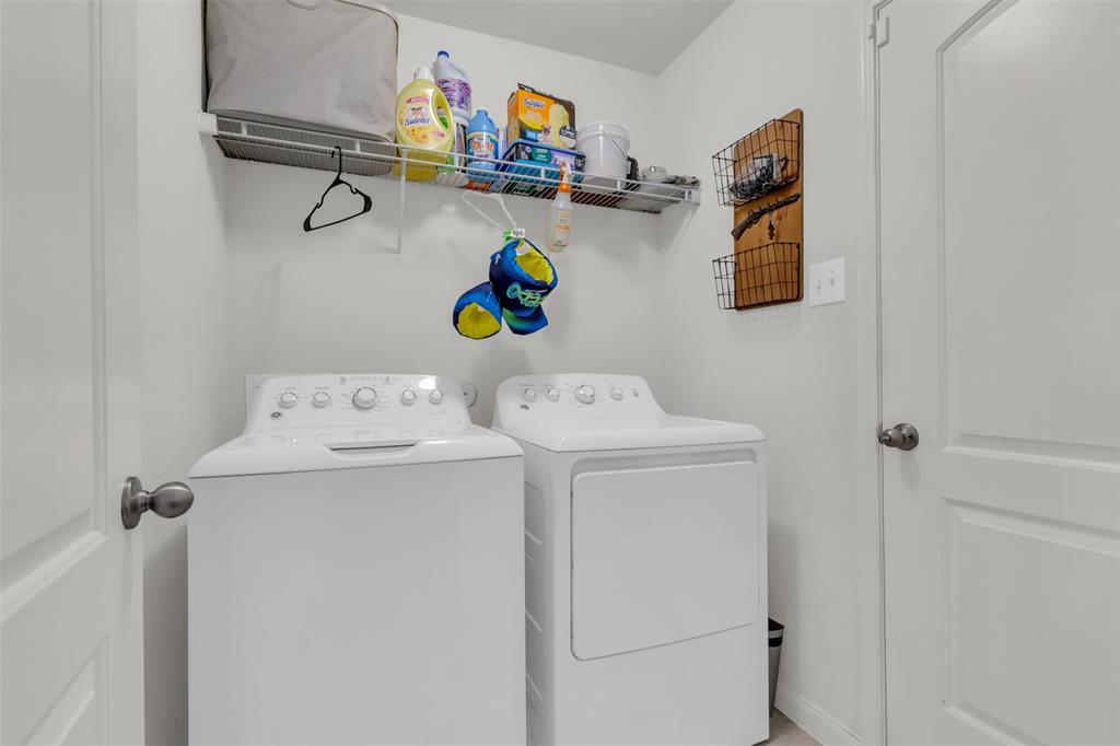 1911 Pilot Point Way Princeton, TX 75407 - Photo 21 of 23 a utility room with dryer and washer