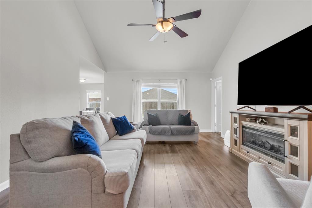 1911 Pilot Point Way Princeton, TX 75407 - Photo 7 of 23 a living room with furniture and a flat screen tv