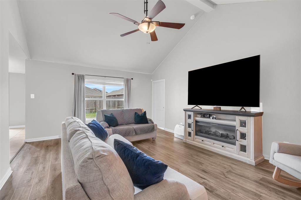 1911 Pilot Point Way Princeton, TX 75407 - Photo 8 of 23 a living room with furniture and a flat screen tv