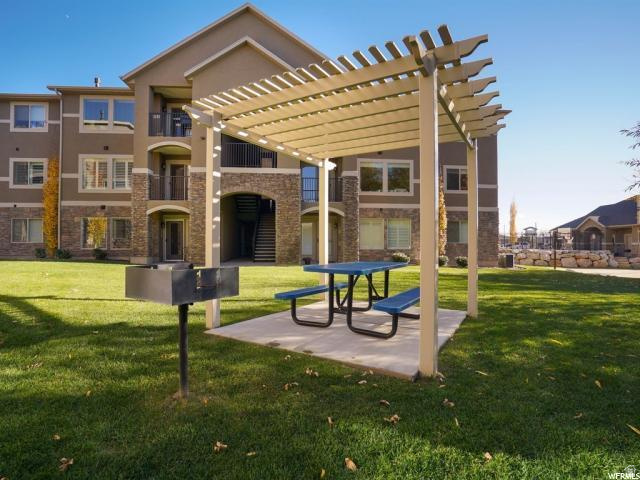 917 South Main Street, Unit H Layton, UT 84041 - Photo 17 of 19 View of home's community featuring a pergola and a patio