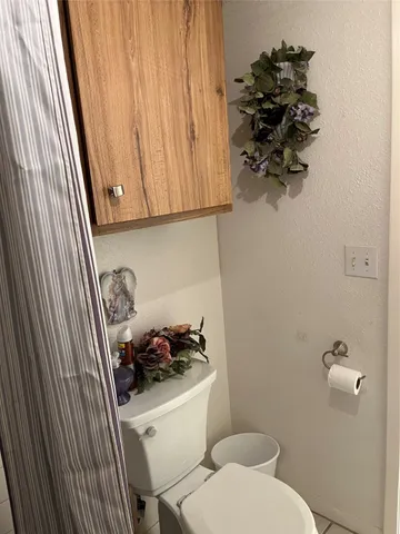 a bathroom with a toilet and a sink