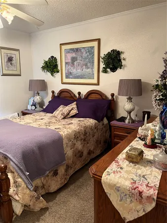 a bed room with a bed and a mirror