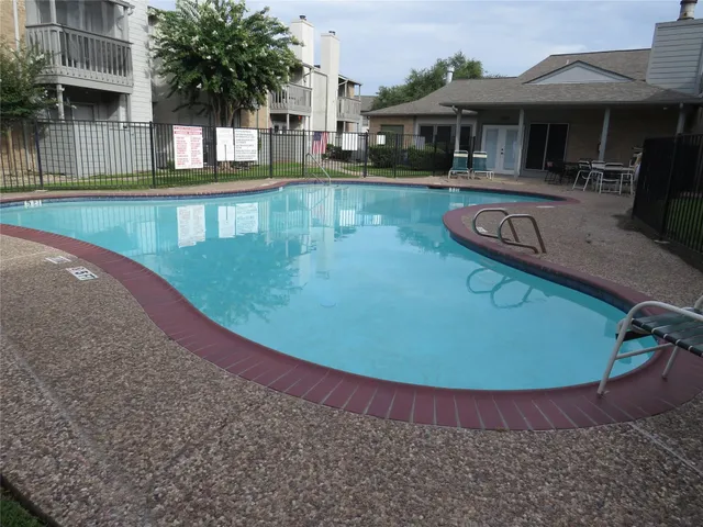 a view of a house with swimming pool