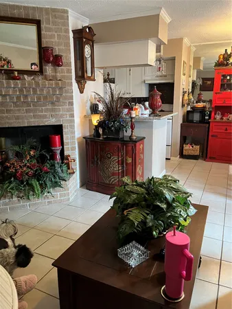a kitchen with a potted plant on the counter and cabinets
